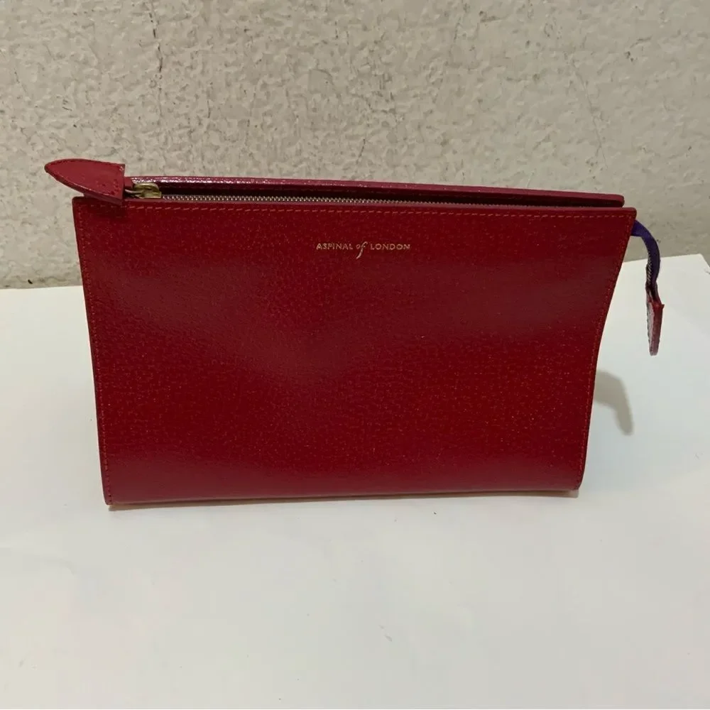 NWOT Aspinal of London red reptile cosmetic case.